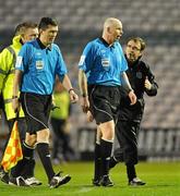 6 April 2010; Bohemians manager Pat Fenlon with referee Dave McKeon as the teams leave the pitch for half-time. Airtricity League, Premier Division, Bohemians v St. Patrick’s Athletic, Dalymount Park, Dublin. Picture credit: David Maher / SPORTSFILE