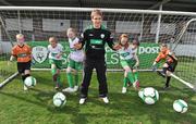 8 April 2010; Republic of Ireland International Kevin Doyle with, from left, Kate Robinson, from Donabate, Dublin, Zack Walsh, from Carrigaline, Cork, Orla McCafferty, from Knocknacarra, Galway, Caoimhe McLaughlin, from Carndonagh, Donegal, Jack Lavin, from Corrib Park, Galway, and Bobby O'Meara, from Limerick, at the launch of the FAI 2010 An Post FAI Summer Soccer Schools Programme. The 5 day camps will see up to 20,000 children from all over Ireland participating at over 270 venues nationwide. The An Post FAI Summer Soccer Schools offer children, from the ages of 6 to 14, a fun and healthy summer activity. The camps provide value for money and are focused on participation rather than competition. Running from July 5 to August 28, each week-long (Monday to Friday, 10.30am to 3.00pm) school is run under the direction of the FAI Technical Director Packie Bonner, and delivered by FAI-qualified coaches, all Garda-vetted in a safe and professional environment. Home Farm FC, Whitehall, Dublin. Picture credit: Brian Lawless / SPORTSFILE
