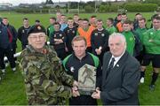 4 April 2016; Brigadier General Philip Brennan and FAI President Tony Fitzgerald make a presentation to , Defence Forces National Team captain Trevor Gethins at the end of the game. Defence Forces National Team v Colleges & Universities National Team, Camp Field, Collins Barracks, Cork. Picture credit: David Maher / SPORTSFILE