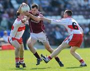 11 April 2010; Conor Healy, Galway, in action against Gerard O Kane and Barry McGuigan, Derry. Allianz GAA Football National League Division 1 Round 7, Galway v Derry, Pearse Stadium, Galway. Picture credit: Ray Ryan / SPORTSFILE