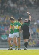 11 April 2010; Referee Maurice Condon issues Declan O'Sullivan, Kerry, left, with a red card as team-mate Paul Galvin remonstrates. Allianz GAA Football National League Division 1, Round 7, Kerry v Monaghan, Fitzgerald Stadium, Killarney, Co. Kerry. Picture credit: Stephen McCarthy / SPORTSFILE