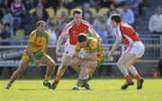 11 April 2010; Stephen Griffen, Donegal, in action against Brian Donaghy and Andy Mallon, Armagh. Allianz GAA Football National League Division 2 Round 7, Donegal v Armagh, O'Donnell Park, Letterkenny, Co. Donegal. Picture credit: Oliver McVeigh / SPORTSFILE