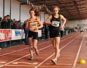 10 April 2010; Emma Prendeville, from Farranfore Maine Valley AC, right, crosses the finish line to win the U18 Girls 1500m Walk while Emma Doherty, from North Belfast Harriers AC, left, wins the U19 Girls 1500m Walk. Woodie's DIY Juvenile Indoor Championships, Nenagh Indoor Arena, Nenagh, Co. Tipperary. Picture credit: Pat Murphy / SPORTSFILE