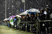 9 April 2016; Supporters watch the game in the snow before the match was abandoned. FAI Junior Cup Semi-Final in association with Aviva and Umbro, St. Peters FC v Pike Rovers, Leah Victoria Park, Tullamore, Co. Offaly. Picture credit: Brendan Moran / SPORTSFILE