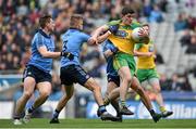 10 April 2016; Stephen McBrearty, Donegal, is tackled by Jonny Cooper, centre, John Small, left, and James McCarthy. Allianz Football League, Division 1, Semi-Final, Dublin v Donegal, Croke Park, Dublin. Picture credit: Brendan Moran / SPORTSFILE
