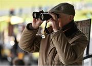 10 April 2016; Shay Byrne, from Stillorgan, Co. Dublin, peers through binoculars on during the races. Leopardstown, Co. Dublin. Picture credit: Cody Glenn / SPORTSFILE
