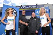 19 April 2010; Irish Open Champion Shane Lowry pictured with Stephen Flynn, Atlas Tyres, and models Nadia Forde, left, and Jenny Lee Masterson at Atlas Tyres newly opened depot in Baldoyle, Dublin, at the announcement of his new sponsorship deal with the company. Atlas Tyres customers can have an opportunity to play golf with Shane Lowry. Further details are available at www.atlastyres.ie or by visiting one of Atlas Tyres Dublin depots. Atlas Tyres and Auto Services Depot, Baldoyle, Dublin. Picture credit: David Maher / SPORTSFILE