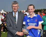 17 April 2010; Niamh O'Sullivan, Mercy Heights, Skibbereen, is presented with the Player of the Match award by Dan O'Mahony, President of the Munster Ladies Football Association. Tesco All-Ireland Post Primary Schools Senior C Final, Mercy Heights, Skibbereen, Cork v Scoil Mhuire, Strokestown, Roscommon. Croagh, Limerick. Picture credit: Diarmuid Greene / SPORTSFILE