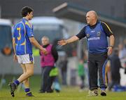 17 April 2010; Tipperary manager John Evans commiserates team captain Ciarán McDonald after he was sent off during the second half. Cadbury GAA Football Under 21 All-Ireland Football Championship Semi-Final, Tipperary v Donegal. Parnell Park, Dublin. Picture credit: Dáire Brennan / SPORTSFILE