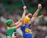 18 April 2010; David Young, Tipperary, in action against Joe Bergin, Offaly. Allianz GAA Hurling National League  Division 1 Round 7, Offaly v Tipperary, O'Connor Park, Tullamore, Co. Tipperary. Picture credit: David Maher / SPORTSFILE