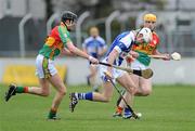 18 April 2010; Tommy Fitzgerald, Laois, in action against Edward Coady and Damien Roberts, right, Carlow. Allianz GAA Hurling National League, Division 2, Round 7, Carlow v Laois, Dr Cullen Park, Carlow. Picture credit: Brian Lawless / SPORTSFILE