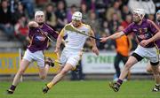 18 April 2010; Neil McManus, Antrim, in action against Colm Farrell, right, and Ciaran Kenny, Wexford. Allianz GAA Hurling National League, Division 2, Round 7, Wexford v Antrim, Wexford Park, Wexford. Picture credit: Matt Browne / SPORTSFILE