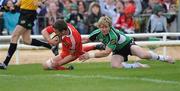 18 April 2010; Niall Ronan, Munster, scores a try despite the efforts of Fionn Carr, Connacht. Celtic League, Connacht v Munster, Sportsground, Galway. Picture credit: Ray Ryan / SPORTSFILE
