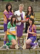 19 April 2010; At a captain's day photocall ahead of the 2010 National Camogie League Division 1 and 2 Finals, Division 1 captains Una Leacy, back left, Wexford, and Anne Dalton, Kilkenny with Joan O'Flynn, President, Cumann Camogaiochta na nGael and Division 2 captains Michaela Morkan, front left, Offaly, and Ciara O'Connor, Wexford. Both finals take place in Semple Stadium, Thurles, on Saturday next, 24th April, with the Division 2 Final at 2pm and the Division 1 Final at 4pm. Maldron Hotel, Grand Canal, Dublin. Picture credit: Brendan Moran / SPORTSFILE