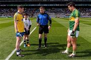 10 April 2016; Allianz junior whistler Cory Tighe, from Scoil Mhearnog, Portmarnock, with referee Padraig Hughes and team captains Ciaran Murtagh, Roscommon, and Aidan O’Mahony, Kerry, at the Kerry v Roscommon game. Allianz Football League, Division 1, Semi-Final, Kerry v Roscommon, Croke Park, Dublin. Picture credit: Brendan Moran / SPORTSFILE