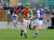 18 April 2010; David English, Carlow, in action against James Walsh, Laois. Allianz GAA Hurling National League, Division 2, Round 7, Carlow v Laois, Dr Cullen Park, Carlow. Picture credit: Brian Lawless / SPORTSFILE