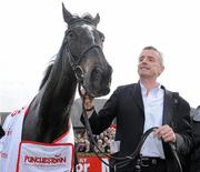 21 April 2010; War Of Attrition who finished second, with his owner Ryanair Chief Executive Officer Michael O'Leary, in The Punchestown Guinness Gold Cup. Punchestown Racing Festival, Punchestown, Co. Kildare. Picture credit: Matt Browne / SPORTSFILE