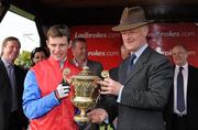 22 April 2010; Jockey Paul Townend and trainer Willie Mullins celebrate with the Ladbrokes.com World Series Hurdle trophy. Punchestown Racing Festival, Punchestown, Co. Kildare. Picture credit: Matt Browne / SPORTSFILE