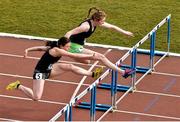 15 April 2016; Sinead McDonough, DCU, right, on her way to winning the 100m women's hurdles event ahead of Alex Hughes, DCU. Irish Universities Athletic Association Track & Field Championships 2016, Day 1. Morton Stadium, Santry, Co. Dublin. Picture credit: Cody Glenn / SPORTSFILE