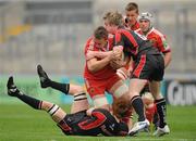 24 April 2010; Tommy O'Donnell, Munster, is tackled by Sean Dougal, left, and Ali Birch, Ulster Ravens. British and Irish Cup Semi-Final, Munster v Ulster Ravens, Thomond Park, Limerick. Picture credit: Diarmuid Greene / SPORTSFILE