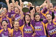 24 April 2010; Wexford captain Una Leacy and her team-mates celebrate with the cup. Division 1 Camogie National League Final, Offaly v Wexford, Semple Stadium, Thurles, Co. Tipperary. Picture credit: Brian Lawless / SPORTSFILE