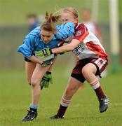 24 April 2010; Dearbhla Reilly, Eureka SS, in action against Louise Kelly, St Paul’s. Tesco All-Ireland Junior B Post Primary Schools Final, Eureka SS, Kells v St Paul’s, Bessbook, Armagh, Gaelic Grounds, Drogheda, Co. Louth. Photo by Sportsfile