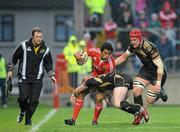 24 April 2010; Lifeimi Mafi, Munster, is tackled by Shane Williams, left, and Alun Wyn Jones, Ospreys. Celtic League, Munster v Ospreys, Thomond Park, Limerick. Picture credit: Diarmuid Greene / SPORTSFILE