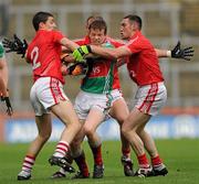 25 April 2010; Donal Vaughan, Mayo, is tackled by Cork players, from left to right, Ray Carey, Alan O'Connor and Noel O'Leary. Allianz GAA Football National League Division 1 Final, Cork v Mayo, Croke Park, Dublin. Photo by Sportsfile