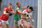 25 April 2010; Patrick O'Shea, Cork, supported by team-mate Jamie O'Sullivan, left, in action against Trevor Mortimer, Mayo. Allianz GAA Football National League Division 1 Final, Cork v Mayo, Croke Park, Dublin. Picture credit: Pat Murphy / SPORTSFILE