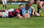 16 April 2016; Peadar Timmins, UCD, scores his side's second try despite the efforts of Rob McGrath, Clontarf. Ulster Bank League Division 1A, Final Round, Clontarf v UCD. Castle Avenue, Clontarf, Dublin. Picture credit: Cody Glenn / SPORTSFILE