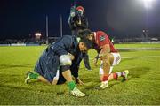 16 April 2016; Bundee Aki, Connacht, and Francis Saili, Munster, pray after the game. Guinness PRO12 Round 20, Connacht v Munster. The Sportsground, Galway.  Picture credit: Stephen McCarthy / SPORTSFILE