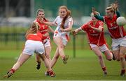 17 April 2016; Bliathin Mackin, Armagh, scores a point, under pressure from Cork's Roisin Phelan, left, Vera Foley and Briege Corkery. Lidl Ladies Football National League Division 1 Round 7, Cork v Armagh. GAA National Training Centre, Abbotstown, Dublin.  Picture credit: Seb Daly / SPORTSFILE