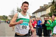 17 April 2016; Daire Bermingham, Raheny Shamrock AC, Dublin, crosses the line to win the Senior Men's relay race, during the Glo Health AAI National Road Relays. Raheny, Dublin. Picture credit : Tomás Greally / SPORTSFILE