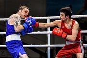 17 April 2016; Volkan Gokcek, Turkey, right, exchanges punches with David Joyce, Ireland, during their Men's Lightweight 60kg Box-Off bout. AIBA 2016 European Olympic Qualification Tournament Event. Samsun, Turkey. Photo by Sportsfile