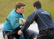 27 April 2010; Leinster's Brian O'Driscoll is tackled by Eoin Reddan, bottom, and Rob Kearney during squad training ahead of their Heineken Cup Semi-Final against Toulouse on Saturday. Belfield Bowl, Belfield, UCD, Dublin. Picture credit: Pat Murphy / SPORTSFILE