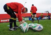 28 April 2010; Munster scrum half Tomas O'Leary takes a match ball before squad training ahead of their Heineken Cup Semi-Final against Biarritz Olympique on Sunday. Musgrave Park, Cork. Picture credit: Matt Browne / SPORTSFILE