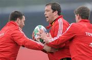 28 April 2010; Munster's Marcus Horan is tackled by Damien Varley, left, and Ronan O'Gara during squad training ahead of their Heineken Cup Semi-Final against Biarritz Olympique on Sunday. Musgrave Park, Cork. Picture credit: Matt Browne / SPORTSFILE