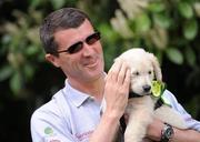 29 April 2010; Current Ipswich Town manager and former Republic of Ireland international Roy Keane with 8 week old puppy Verna at the official launch of the eighth annual Irish Guide Dogs for the Blind Specsavers Shades 2010 campaign. The campaign raises funds for the training of guide and assistant dogs and centres around a week of fundraising nationwide which kicks off on Monday May 3rd. Mount Herbert Hotel, Herbert Road, Sandymount, Dublin. Picture credit: Pat Murphy / SPORTSFILE