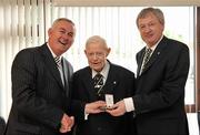 29 April 2010; Uachtarán Chumann Lúthchleas Gael Criostóir Ó Cuana, left, and GAA Ard Stiúrthóir Páraic Duffy, right, present a medal to P.S. O Riain on the announcement of his retirement as Ard Comhairle delegate for Limerick. Munster Council Offices, Groody Hill, Rhebogue, Limerick. Picture credit: Diarmuid Greene / SPORTSFILE