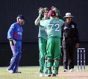 28 April 2010; Ireland's Niall O'Brien and George Dockrell celebrate taking the wicket of Mangal, Afghanistan. 2010 Twenty20 Cricket World Cup Warm Up, Ireland v Afghanistan, Providence, Guayana. Picture credit: Handout / Barry Chambers / RSA / Cricket Ireland Via SPORTSFILE