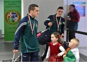 18 April 2016; Team Ireland's David Joyce, who won a Bronze medal at the European Olympic Boxing Qualifiers in Samsun, Turkey, is greeted by his children Rihanna, left, age 6, and Mickey Joe, age 4, on his return home. Dublin Airport, Dublin. Picture credit: Cody Glenn / SPORTSFILE