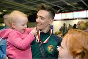 18 April 2016; Team Ireland's Brendan Irvine, who won a Bronze medal at the European Olympic Boxing Qualifiers in Samsun, Turkey, is greeted by his nieces Sophia Muldoon, age 1, and Caitlyn Muldoon, age 9, on his return home. Dublin Airport, Dublin. Picture credit: Cody Glenn / SPORTSFILE