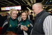 18 April 2016; Team Ireland's Katie Taylor, who won a Bronze medal at the European Olympic Boxing Qualifiers in Samsun, Turkey, signs an autograph for Christopher Desmond, alongside her Team Ireland team-mate Christine Desmond on their return home. Dublin Airport, Dublin. Picture credit: Cody Glenn / SPORTSFILE