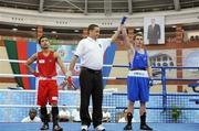 30 April 2010; Ryan Burnett, Ireland, is declared the winner after his 48 Kg bout with Mark Anthony Barriga, Philippines. AIBA Youth World Championships, Baku, Azerbeijan. Picture syndicated by SPORTSFILE on behalf of the AIBA