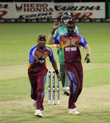 30 April 2010; Dwayne Bravo and Darren Sammy celebrate the dismissal of Kevin O'Brien. 2010 Twenty20 Cricket World Cup Group Stages, Ireland v West Indies, Providence Stadium, Guyana. Picture credit: Handout / Barry Chambers / RSA / Cricket Ireland Via SPORTSFILE