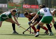 1 May 2010; Eimear Cregan, 6, and Alex Speers, 13, Ireland, contest a ball against Chile. Hockey BDO World Qualifier, Ireland v Chile, Manquehue Hockey Club, Santiago, Chile. Picture syndicated by SPORTSFILE on behalf of the IHA   for editorial use