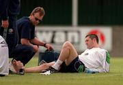 29 May 2001; Robbie Keane is attended to by team physiotherapist, Ciaran Murray, during a Republic of Ireland Training Session at John Hyland Park in Baldonnell, Dublin. Photo by David Maher/Sportsfile