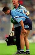 27 May 2001; Enda Sheehy of Dublin leaves the field with a leg injury, accompanied by Dublin team doctor Dr. Noel McCaffrey, during the Bank of Ireland Leinster Senior Football Championship Quarter-Final match between Dublin and Longford at Croke Park in Dublin. Photo by Brendan Moran/Sportsfile