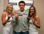 31 May 2001; Snickers, the official snack of the FAI, became Irish soccer's longest standing sponsor today, as they agree to extend their sponsorship of Irish Soccer until at least the end of the 2002 season. Pictured at the announcement are Jennifer Langan, left, Republic of Ireland international Ian Harte, and Roberta Rawat at FAI HQ in Dublin. Photo by Damien Eagers/Sportsfile