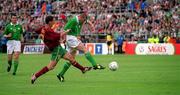 2 June 2001; Roy Keane of Republic of Ireland shoots to score his side's first goal despite the challenge of Arnando Teixeira of Portugal during the FIFA World Cup 2002 Group 2 Qualifier match between Republic of Ireland and Portugal at Lansdowne Road in Dublin. Photo by Aoife Rice/Sportsfile